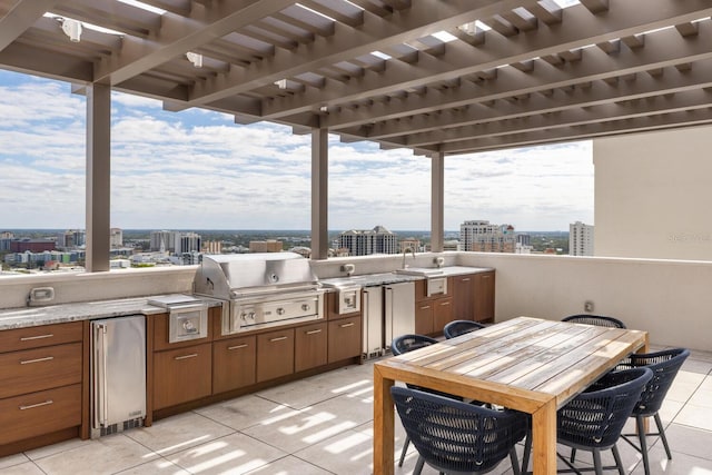 view of patio / terrace with a grill, area for grilling, and a pergola