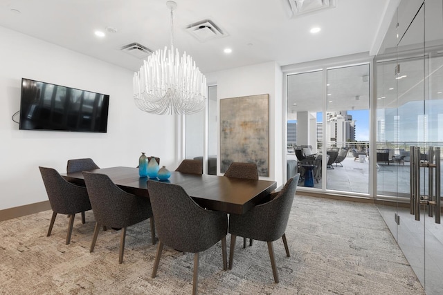 tiled dining room featuring an inviting chandelier