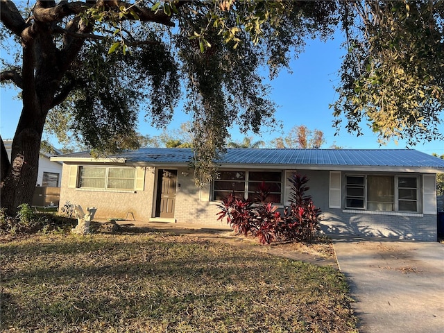 ranch-style home with a front yard