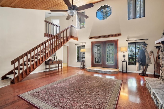 entryway featuring wooden ceiling, high vaulted ceiling, french doors, hardwood / wood-style flooring, and ceiling fan