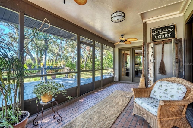 sunroom / solarium with ceiling fan