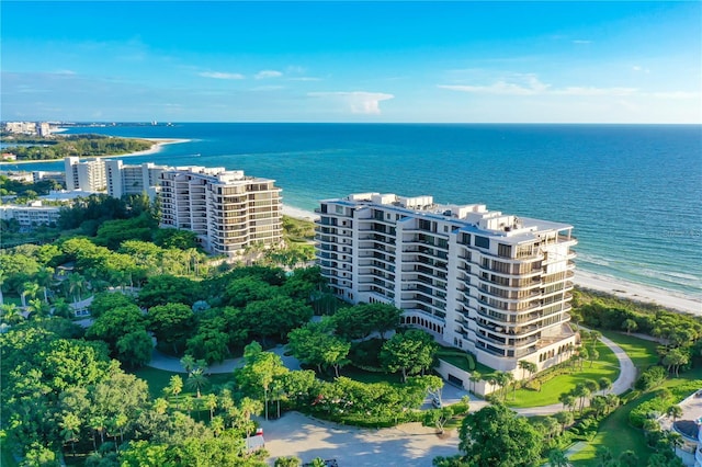 bird's eye view featuring a water view and a view of the beach