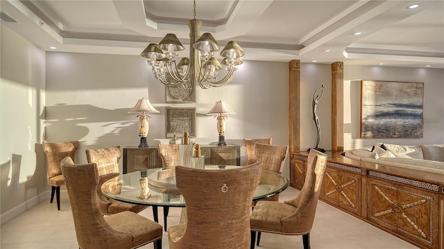 dining space featuring a tray ceiling and a notable chandelier