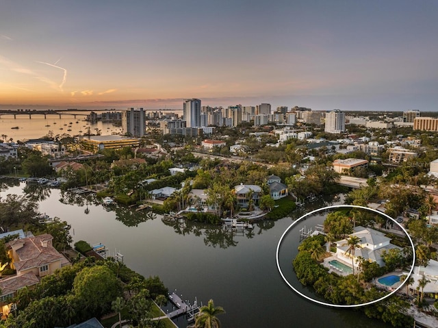 aerial view at dusk with a water view