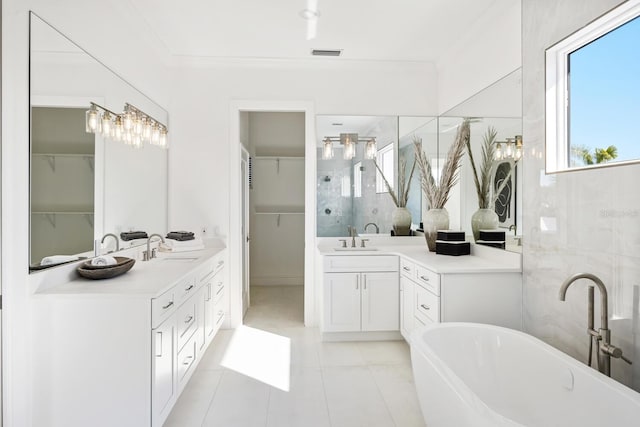 bathroom featuring tile patterned floors, crown molding, vanity, and independent shower and bath