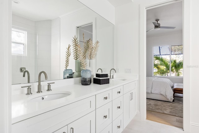 bathroom featuring ceiling fan, tile patterned flooring, vanity, and ornamental molding