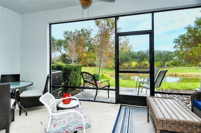 sunroom with a water view and plenty of natural light