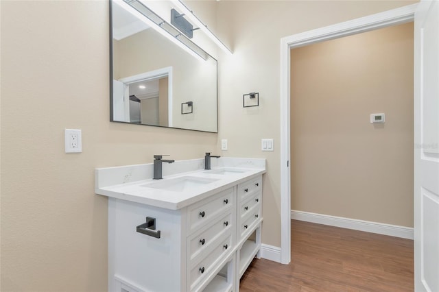 bathroom featuring hardwood / wood-style flooring and vanity