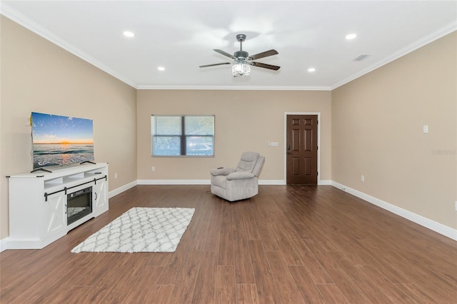 interior space featuring dark hardwood / wood-style floors, ceiling fan, and crown molding