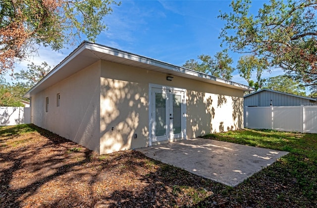 rear view of property featuring a patio