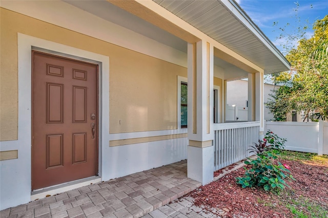 entrance to property with covered porch