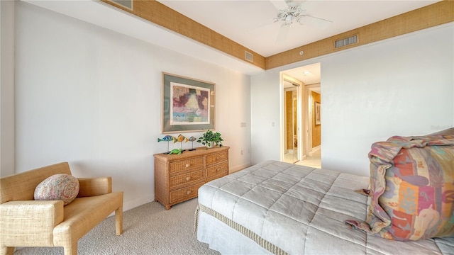 bedroom with connected bathroom, ceiling fan, and light carpet