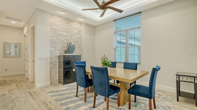 dining space featuring ceiling fan and light wood-type flooring