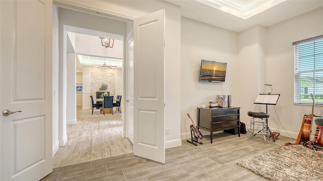 interior space with crown molding and an inviting chandelier