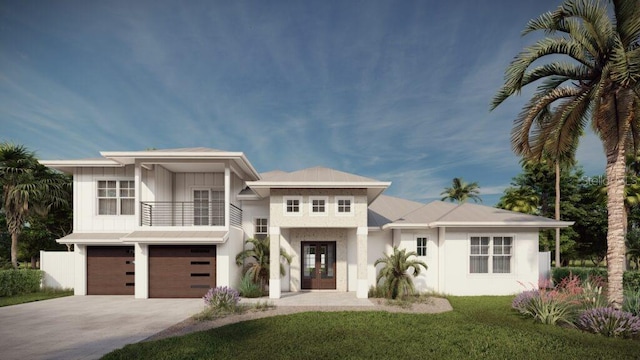 view of front of home featuring a balcony, a front lawn, french doors, and a garage