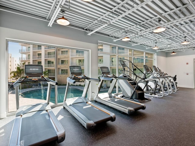 gym featuring a wealth of natural light