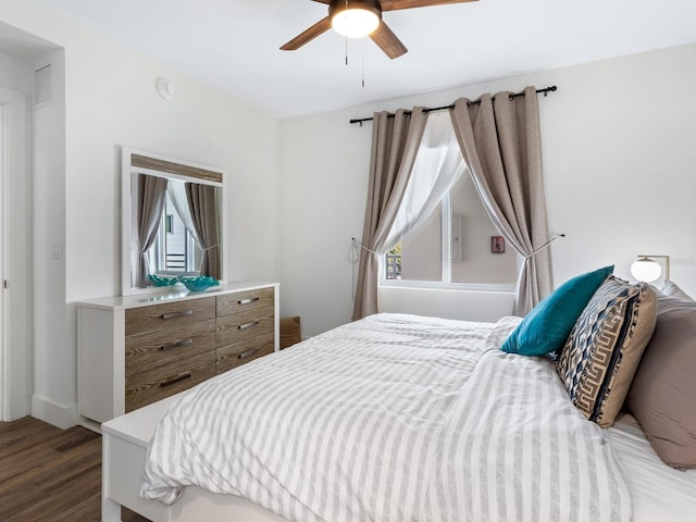 bedroom with hardwood / wood-style flooring and ceiling fan