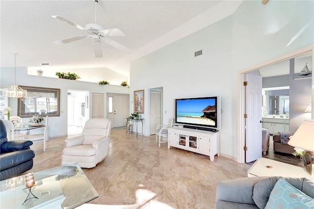 living room featuring ceiling fan with notable chandelier and high vaulted ceiling