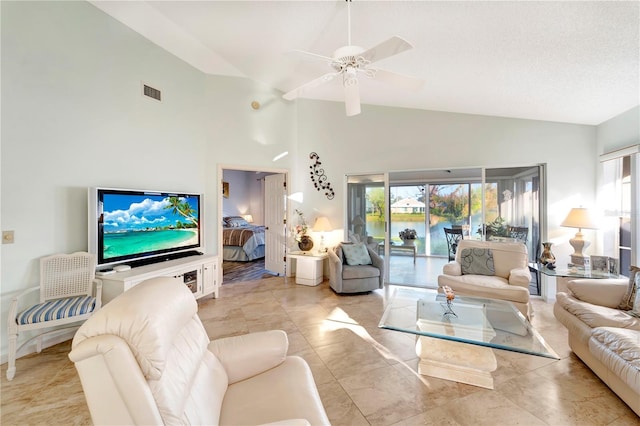 living room with ceiling fan, high vaulted ceiling, and a textured ceiling