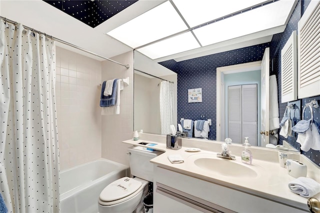 full bathroom with vanity, shower / bath combination with curtain, and toilet