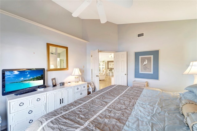 bedroom with lofted ceiling with beams and ceiling fan