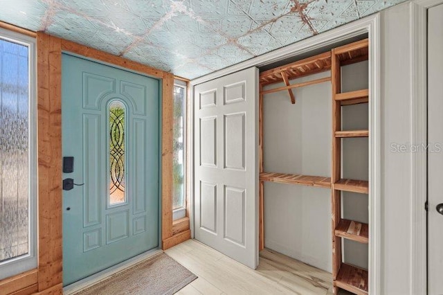 foyer entrance with hardwood / wood-style floors