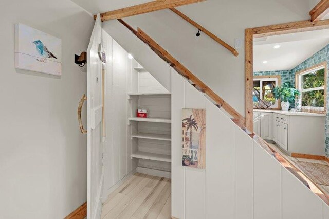 stairway featuring hardwood / wood-style floors