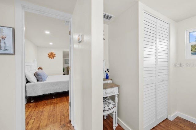 bedroom with wood-type flooring