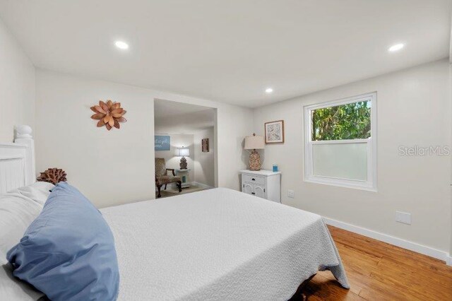 bedroom with wood-type flooring