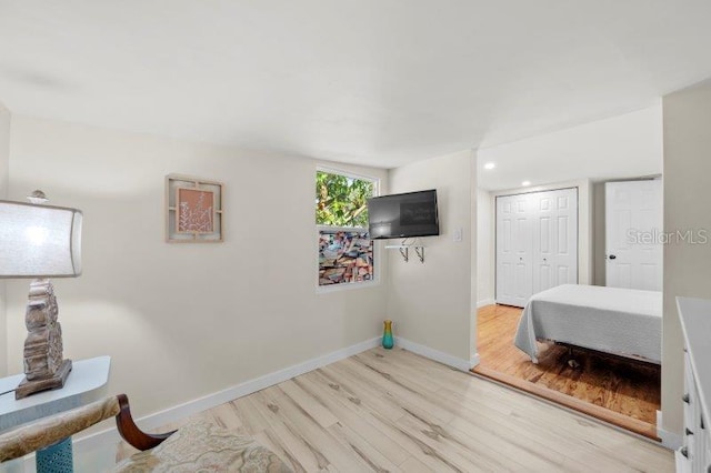 bedroom with a closet and light wood-type flooring