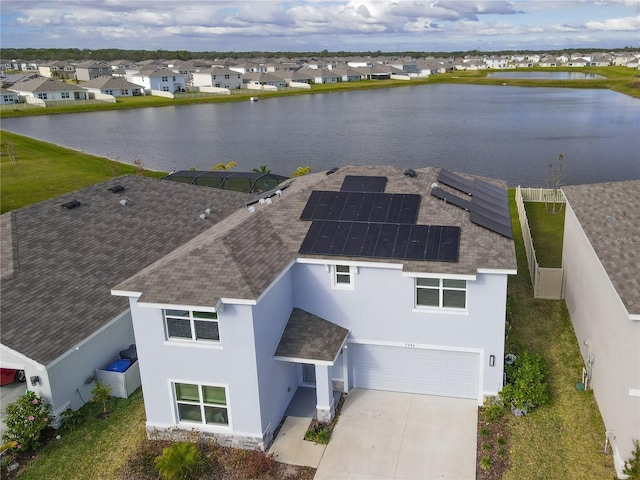 drone / aerial view with a water view