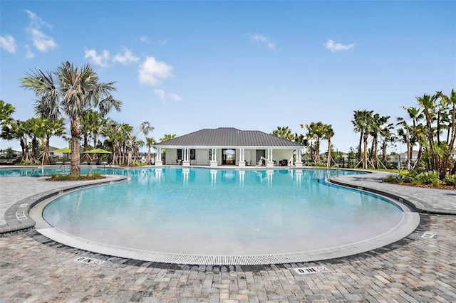 view of swimming pool featuring a patio area