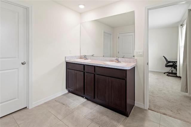 bathroom with tile patterned floors and vanity