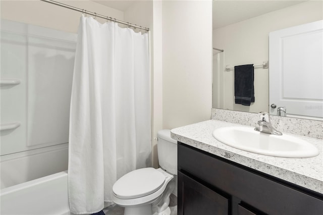 full bathroom with shower / bath combo with shower curtain, vanity, and toilet