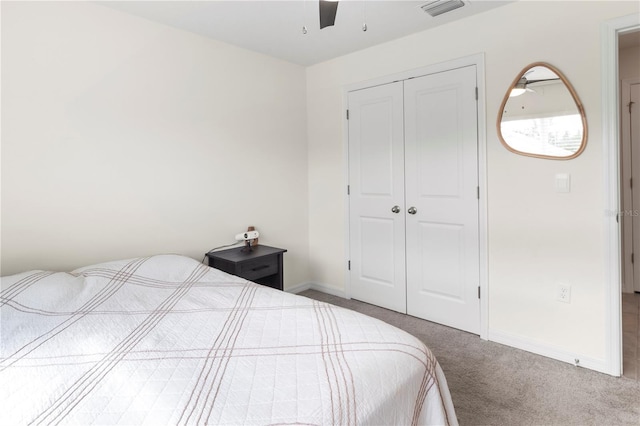 bedroom with carpet, a closet, and ceiling fan