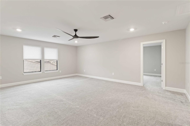 unfurnished room with ceiling fan and light colored carpet