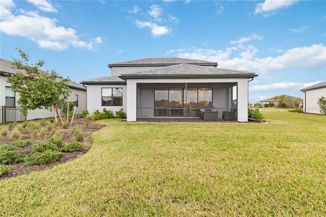 rear view of property with a yard