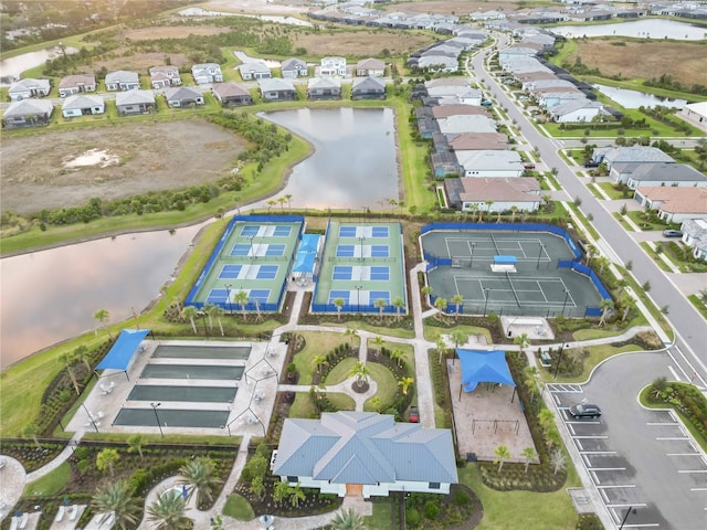 birds eye view of property with a water view