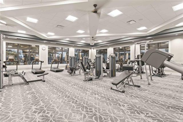 workout area featuring a drop ceiling and carpet floors