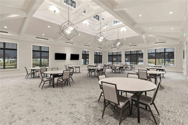 dining area featuring beam ceiling, carpet floors, coffered ceiling, and a high ceiling