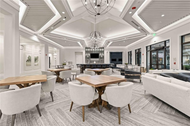 dining space with french doors, crown molding, coffered ceiling, and a notable chandelier