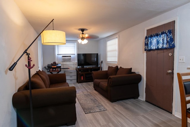 2029 Palm Ter, Sarasota, FL 34231 - living room with light wood-type flooring, cooling unit, and a ceiling fan