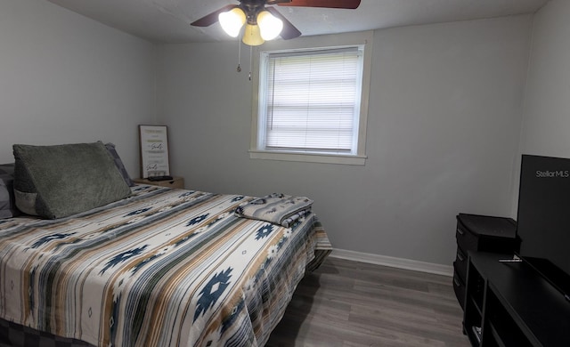 bedroom featuring ceiling fan and hardwood / wood-style flooring