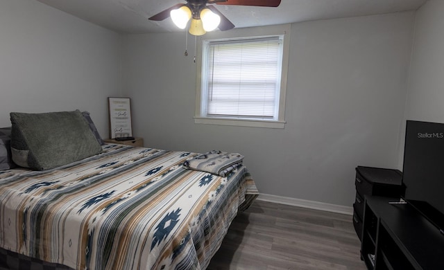 2029 Palm Ter, Sarasota, FL 34231 - bedroom featuring wood finished floors and ceiling fan