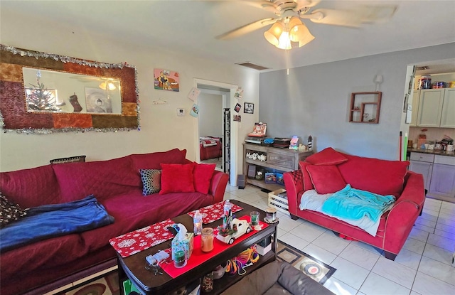 living room featuring ceiling fan and light tile patterned floors