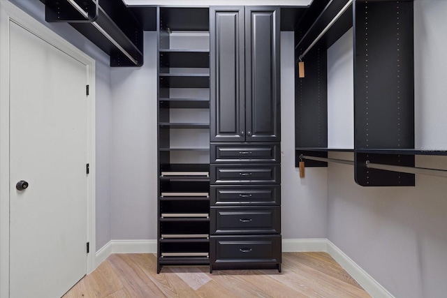 spacious closet featuring hardwood / wood-style floors