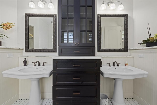 bathroom with tile patterned floors and dual sinks