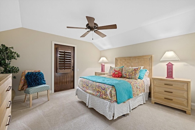 carpeted bedroom featuring vaulted ceiling and ceiling fan