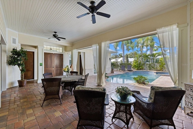 view of patio / terrace featuring ceiling fan