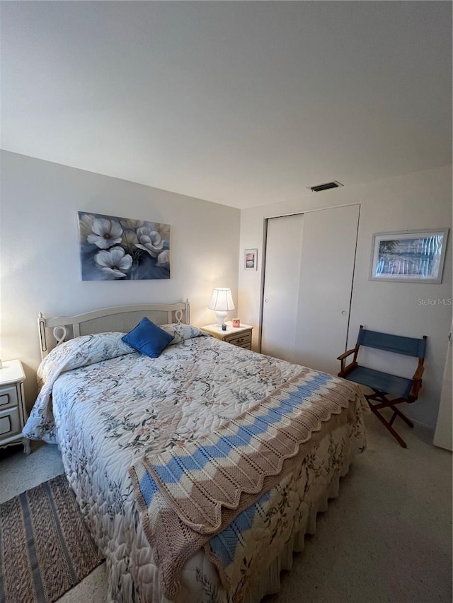 bedroom with a closet and carpet flooring